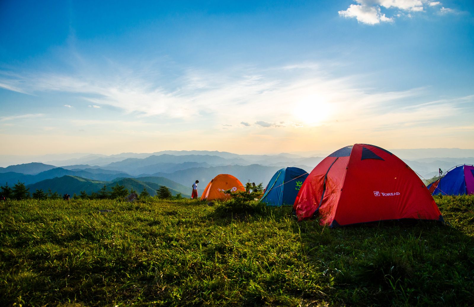 Colourful tents at a mountain campsite